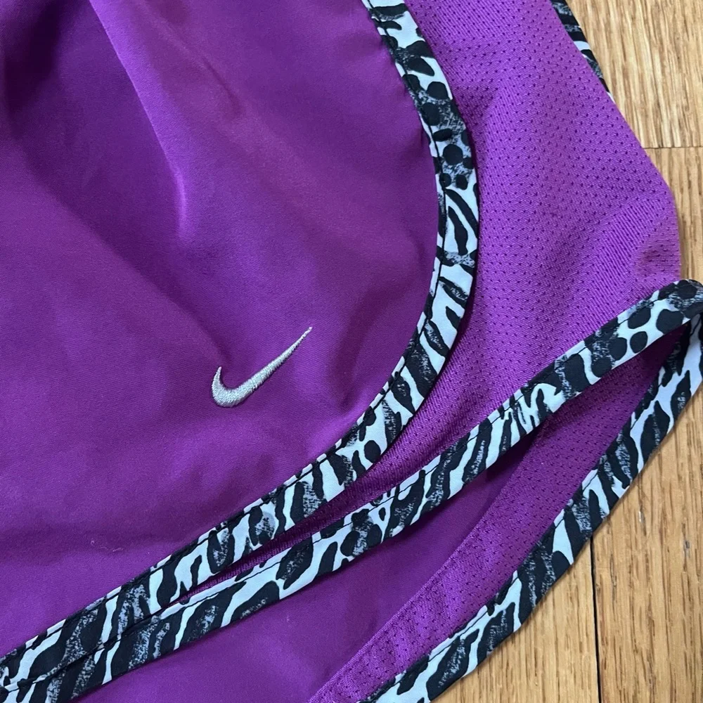 Women’s purple Dri-Fit Nike running shorts with animal print